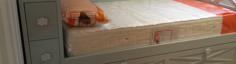 Cama nido con baúl cabecero